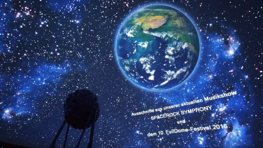Projection of planet Earth into the dome of the Zeiss-Planetarium with a shadow cast by the projector